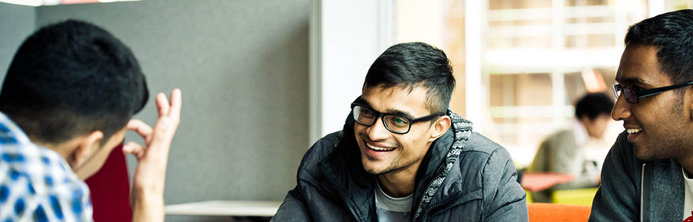 Male students talking and laughing