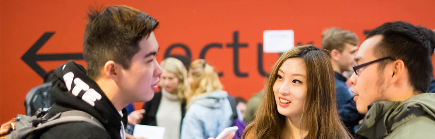 Young students talking to each other
