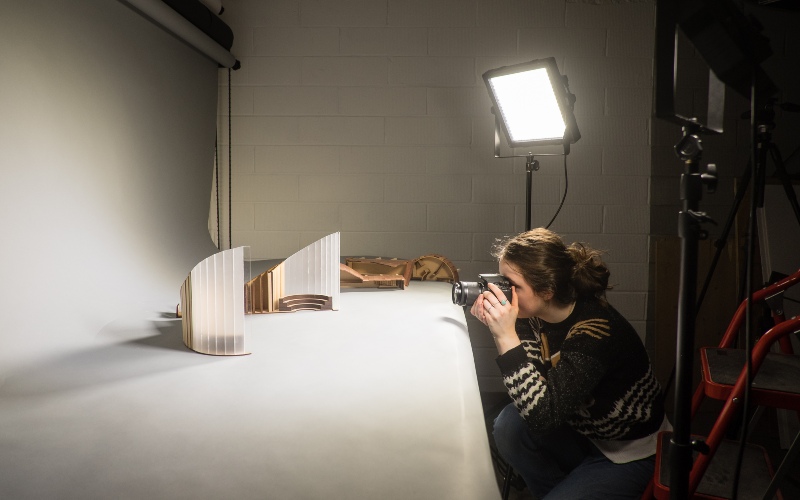 Student taking photo of an architecture model
