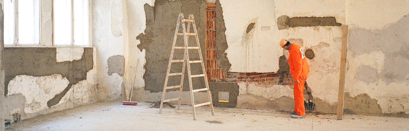 Worker renovating property