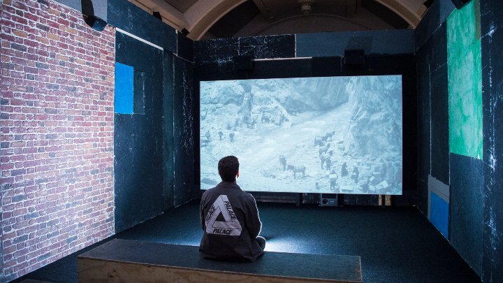 Student watching a digital installation