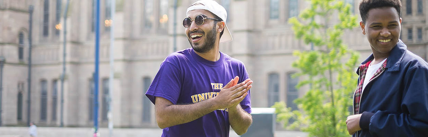 Student ambassadors laughing on campus