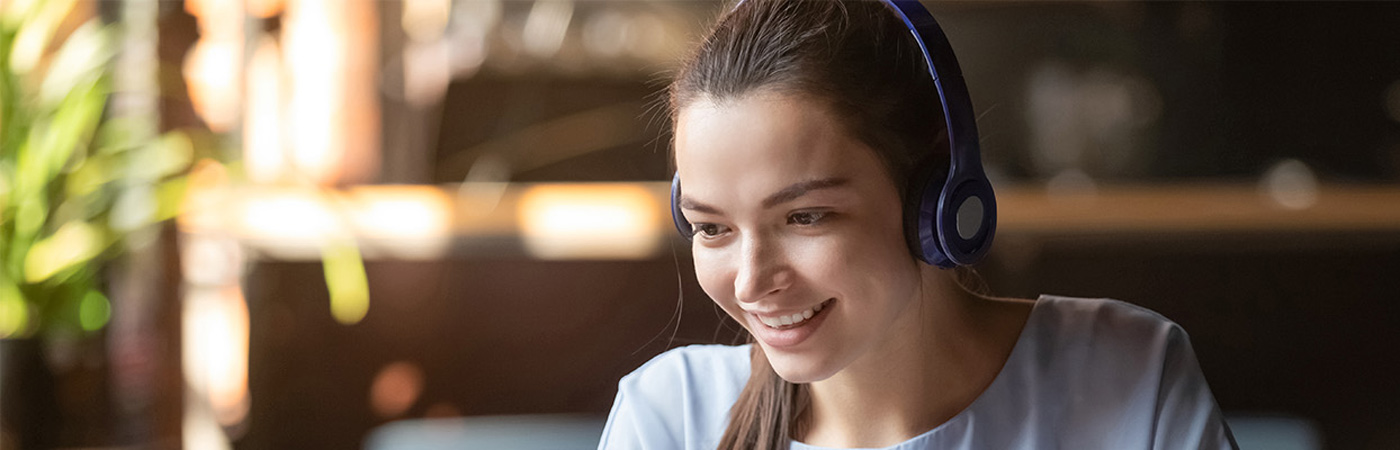 Young woman listening with headphones