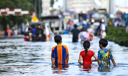 Children in a flooded street