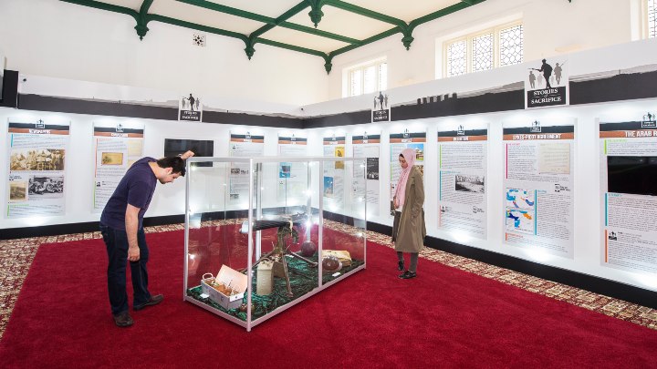 History students are examining an exhibition. 
