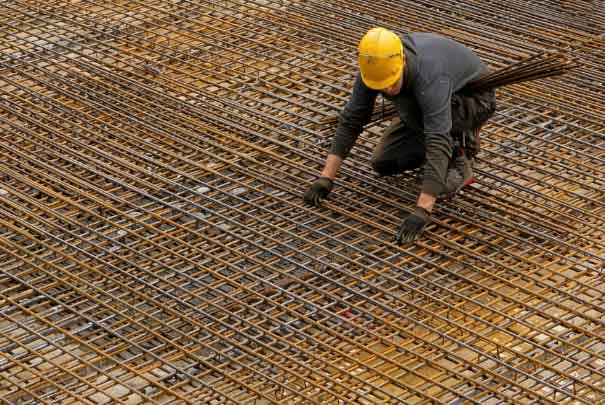 Man stood on rusty cross hatch floor