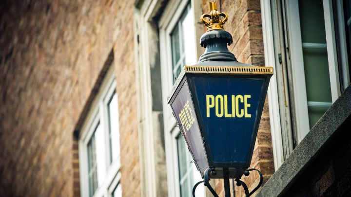 Police lamp on a building 