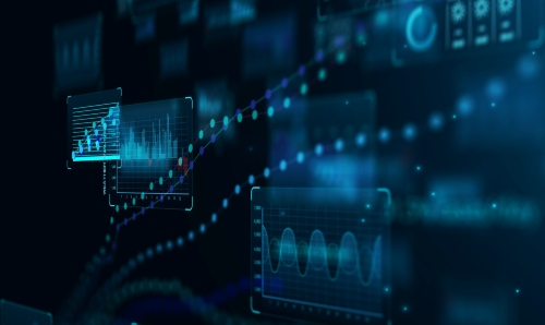 A hooded figure against a wall, image in black and white