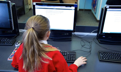 secondary pupil on computer