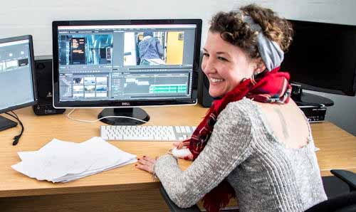 Two students in media editing suite