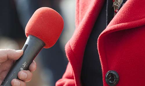 Person holding microphone