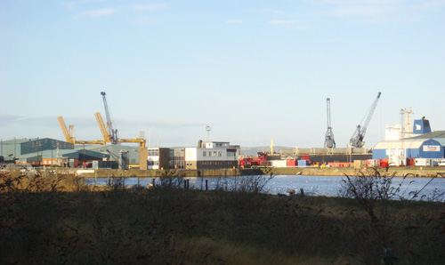Photograph of an industrial port depicting transatlantic travels