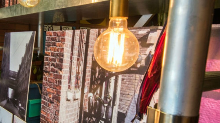 A lightbulb in front of some books