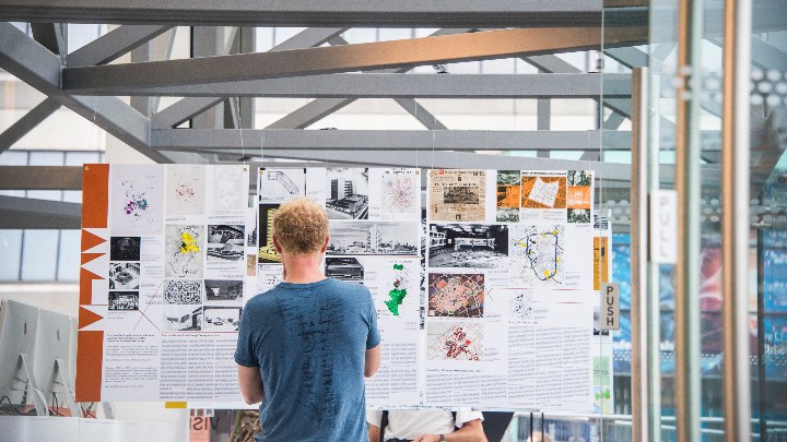 A researcher admiring his work