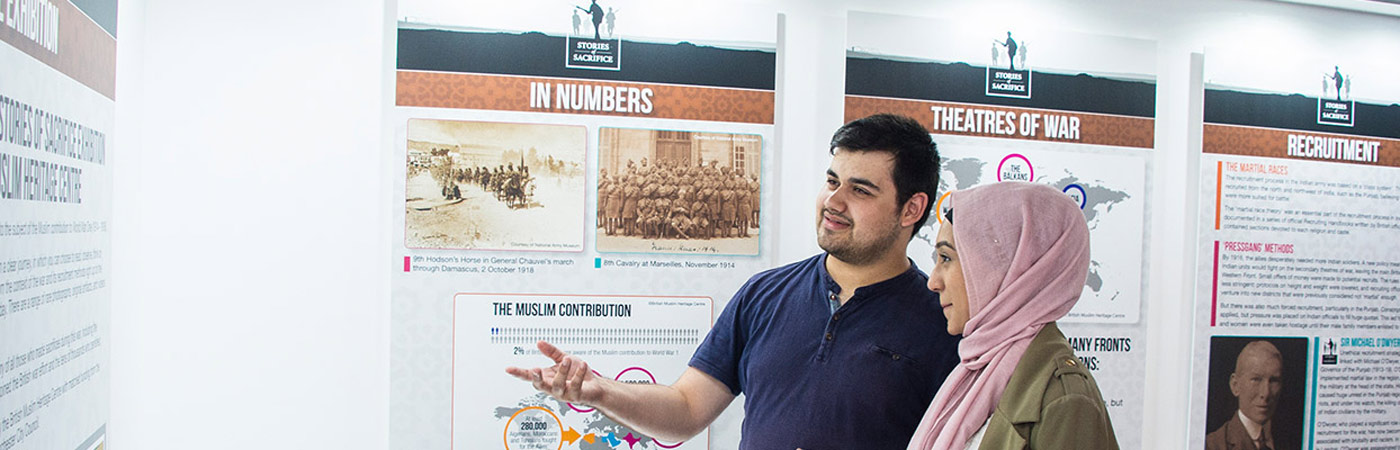 Students looking at display in history exhibit