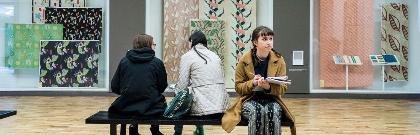 A female student sat in the Whitworth Art Gallery