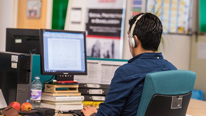 PGR student on a computer