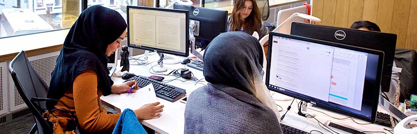 Two female students working on computer