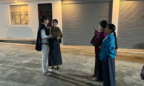 An interview with a man and woman in the street