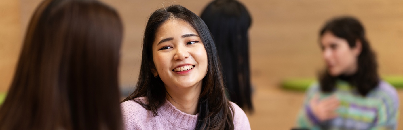 Student smiling to another student 