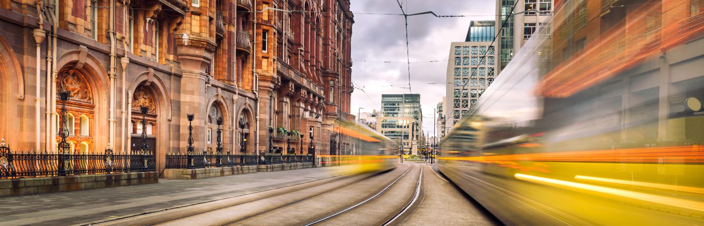 A tram in Manchester City Centre photographed using a slow shutter speed