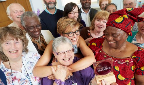 MUARG members smiling with Making a Difference award.