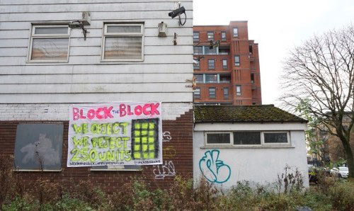 Neglected housing in disrepair with graffiti
