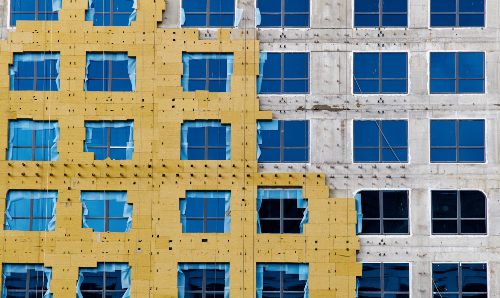 Construction of external wall thermal insulation with rock wool.