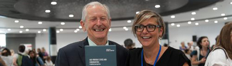 Chris Philipson and Tine Buffel holding up their book.