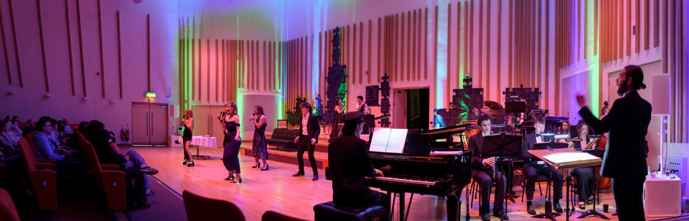 Student musicians performing on stage.