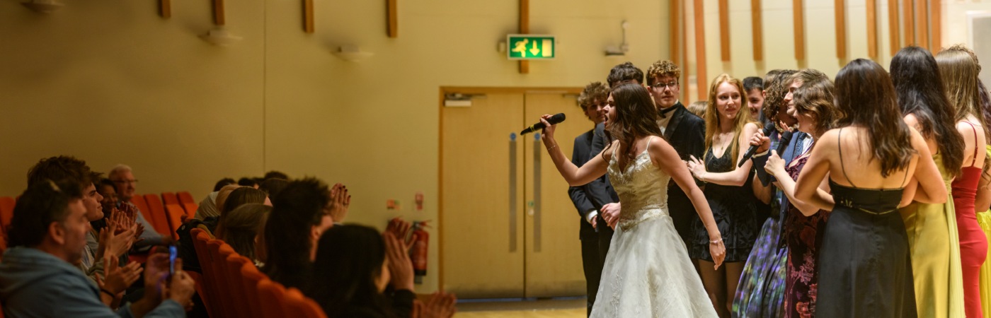 A group of students performing for an audience.