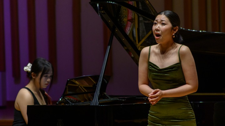 Two students performing.