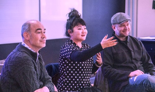 Three speakers at an event.