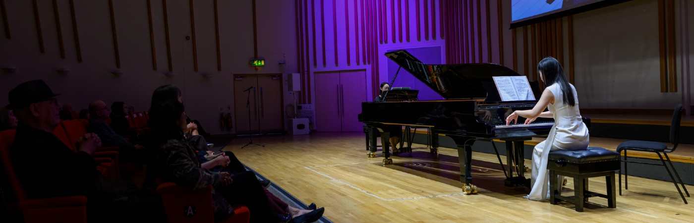 Postgraduate research student performing on the piano.