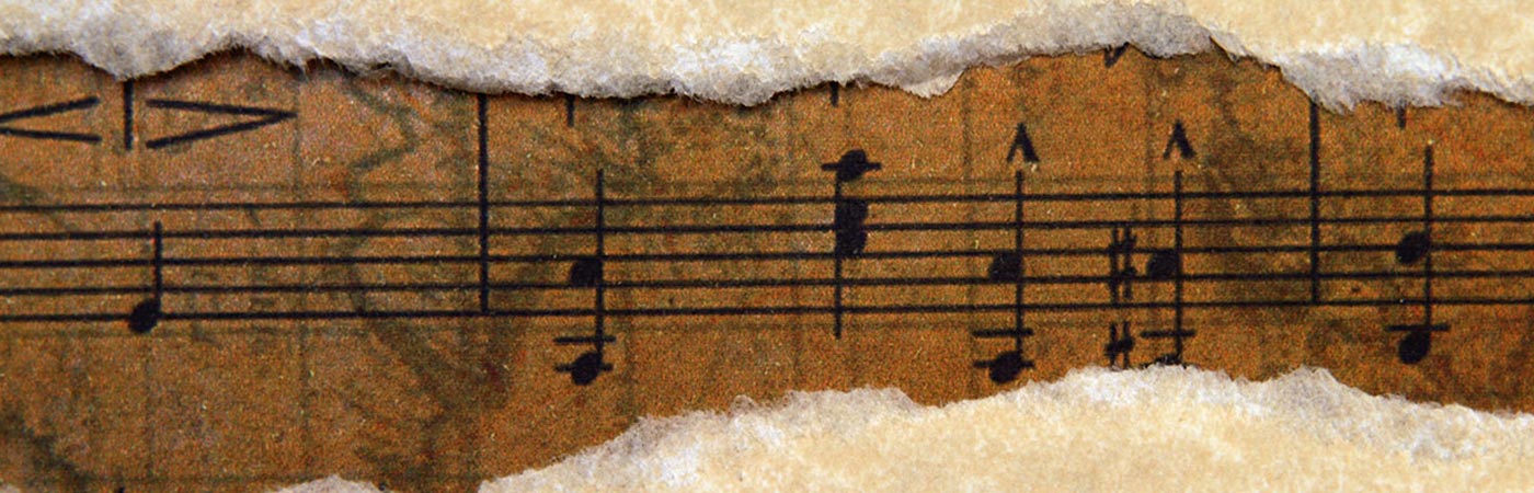 Old music script on torn paper