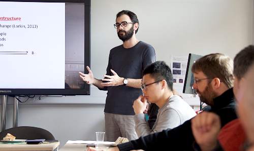 Lecturer talking to students