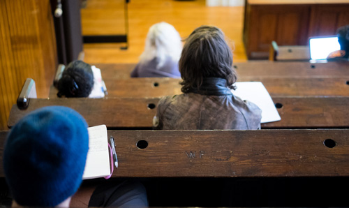 Student in a lecture photographed from the back
