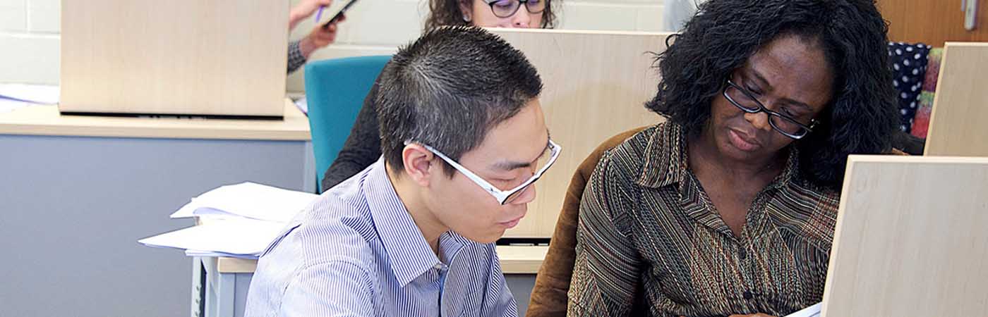 Student and supervisor at computer