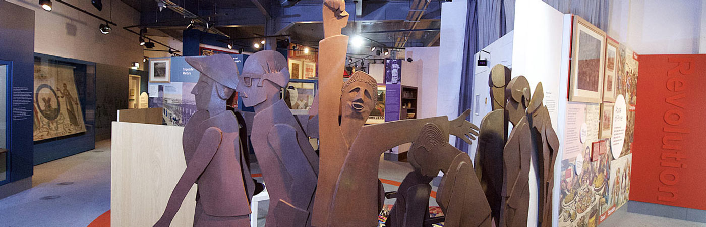 sculpture of people in museum setting