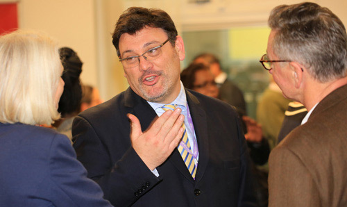 Delegates at a politics event talking.