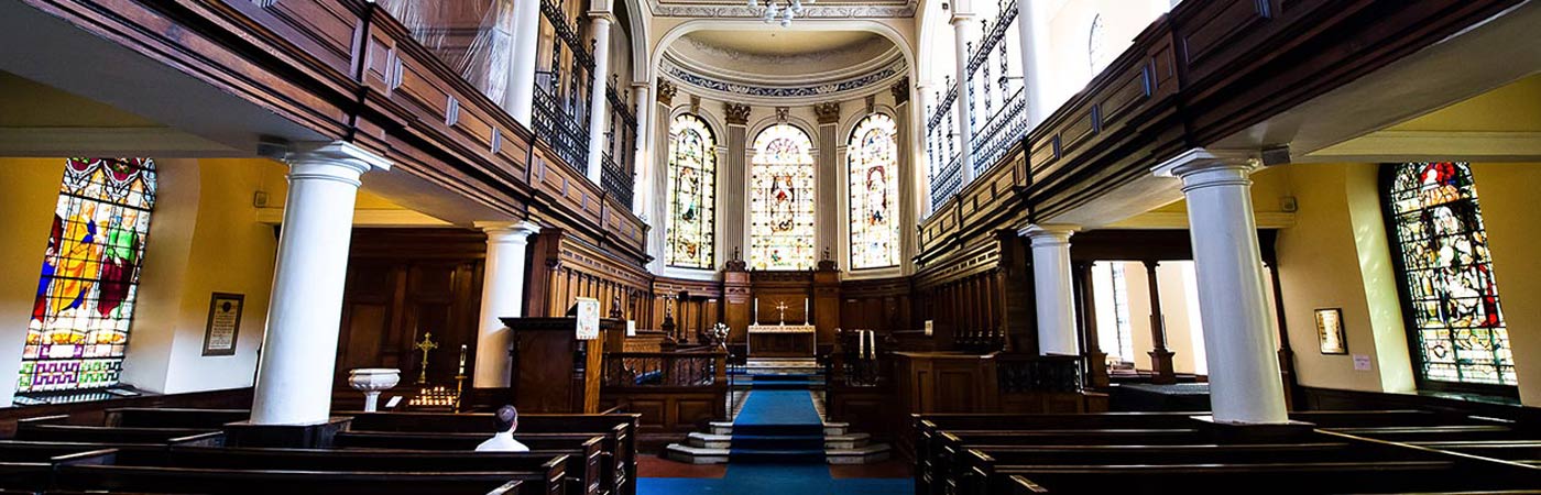 An internal photograph of a large church taken from the rear looking down towards the altar