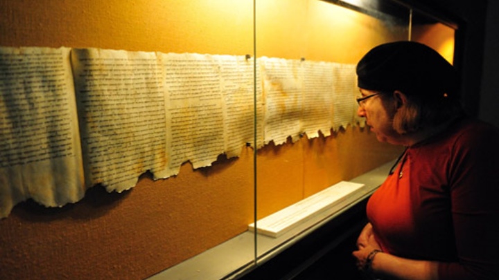 A woman studying text.