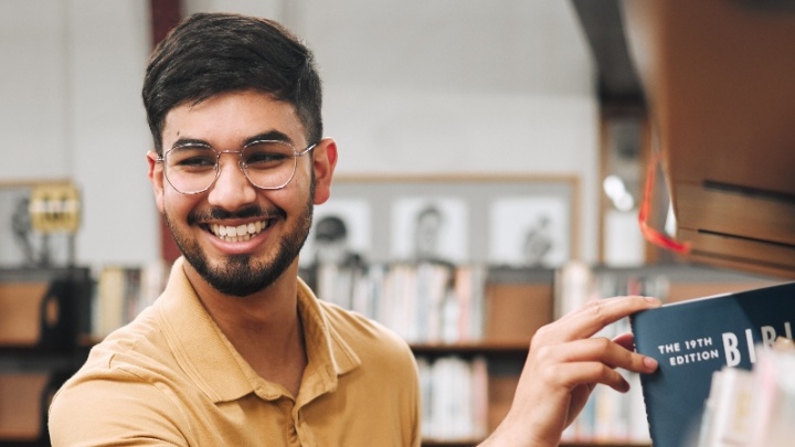 A PGR student with the Bible