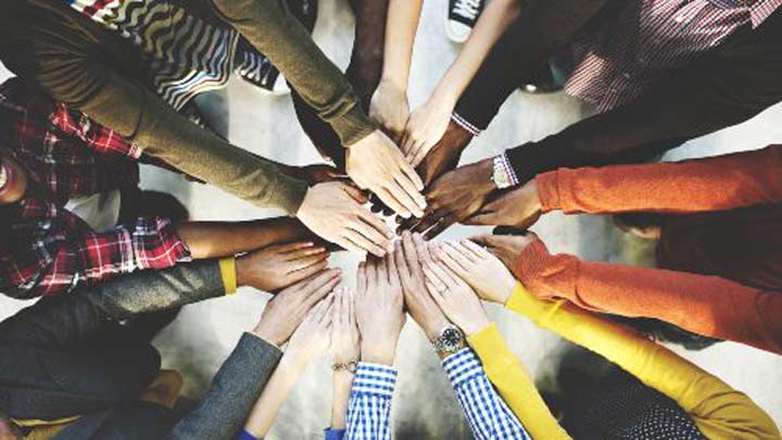 Group of diverse hands together joining concept.