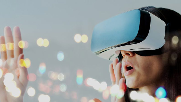 A woman wearing a virtual reality headset.