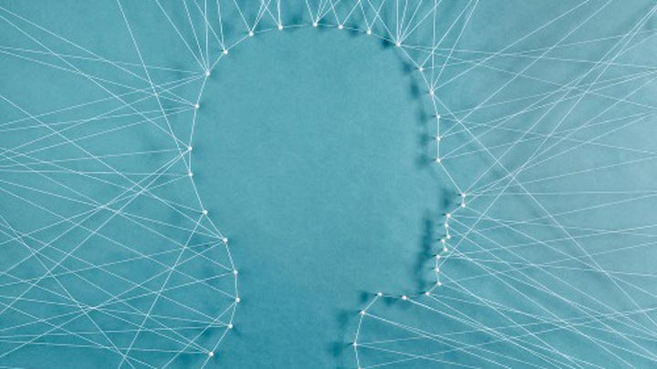 Human head shape made of pins and string