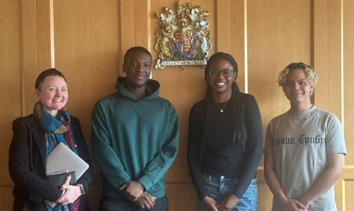 Four students at the Nuremberg Palace of Justice.