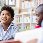 Two young children in a learning environment.