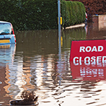 Flooded road with road closed sign