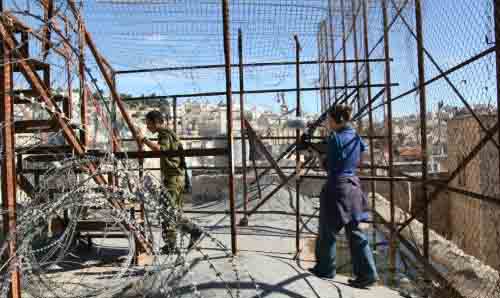Soldier and barbed wire